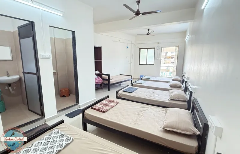 Six Bed Room, the beds and the two bathroom doors