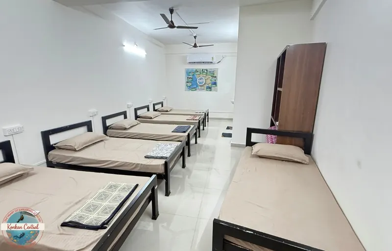 Both floors at Konkan Central Family Rooms: the Six Bed Room seen from the window end